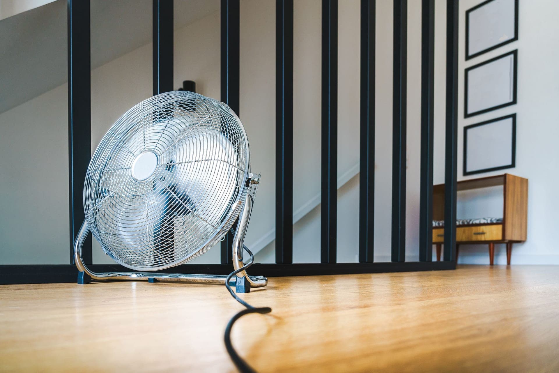 Indoor cycling accessories — a high-flow fan, trainer mat and a cadence sensor